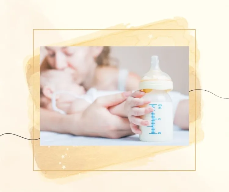 A baby holds a bottle while being cradled by an adult, who is blurred in the background. The image has a soft overlay with a border.