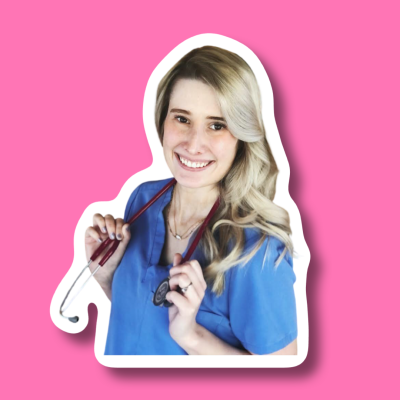 Smiling person wearing blue scrubs and holding a stethoscope around their neck, posed in front of a pink background.